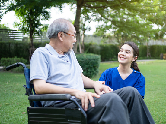 A caregiver providing respite care to a client in their home